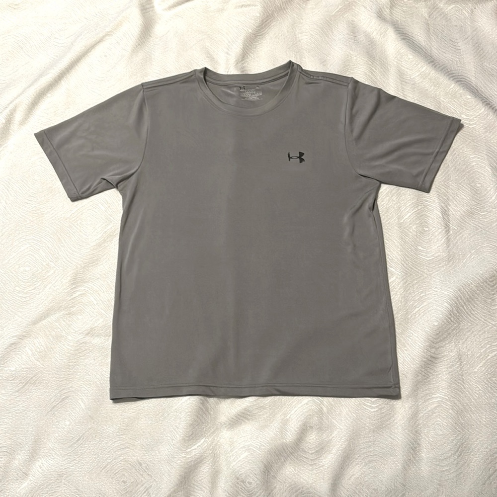 Under armor, medium, gray, logo on front Left chest and back neckline.